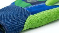 Closeup of athletic shoe with neon green and navy blue mesh fabric texture, showing breathable material construction for sports footwear design and performance sneaker development.