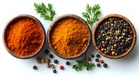 Wooden bowls with colorful spices - paprika powder, curry mix and black peppercorns garnished with fresh parsley leaves on white background. Food seasoning concept.