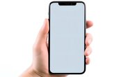 Modern smartphone with blank screen held in caucasian hand isolated on white background, mockup for app and interface design presentation.