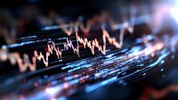 Dynamic stock market chart with glowing lines showing price movements and financial data visualization in blue and orange tones against dark background.