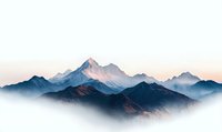Majestic mountain peaks rising above misty valleys at sunrise, layered mountain silhouettes in blue and orange hues create serene wilderness landscape.