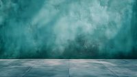 Atmospheric teal green wall and concrete floor background with moody lighting and fog effects, creating dramatic studio photography backdrop space.