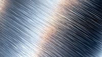 Diagonal metallic brushed steel surface with light reflection creating dynamic pattern of silver and copper tones. Abstract industrial background for modern designs.