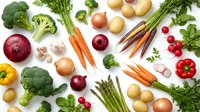 Fresh organic vegetables collection with broccoli, carrots, potatoes, onions, asparagus and leafy greens arranged on white background for healthy cooking.