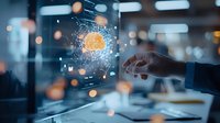 Businessman touching futuristic transparent screen with glowing cryptocurrency symbol surrounded by digital network particles in modern office.