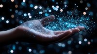 Magical glowing blue sparkles and stardust floating above open palm against dark background with bokeh lights, creating ethereal atmosphere of wonder and fantasy.