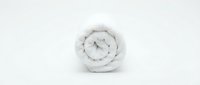 Rolled white comforter or duvet isolated on light background, ready for bedding product design, home textile mockups, and e-commerce applications.