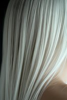 Close-up of platinum blonde hair with silver highlights showing smooth straight strands and natural shine for beauty and hair care concepts.