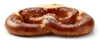Freshly baked pretzel with coarse salt crystals on white background, ready for food photography, bakery marketing, and culinary design projects.
