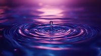 Water droplet creating concentric ripples in purple and blue liquid with glowing neon light effects, suitable for abstract backgrounds and digital design projects.