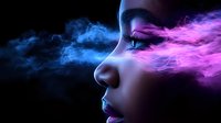 Side profile of woman with closed eyes surrounded by ethereal pink and blue smoke effects creating dreamy atmospheric mood against dark background.
