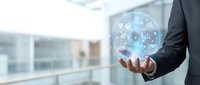 Businessman holding futuristic holographic interface with digital network connections in modern office environment for technology presentations.