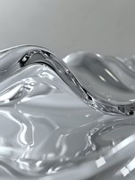 Flowing liquid mercury abstract background with smooth metallic waves and ripples creating dynamic silver surface texture for luxury design projects.