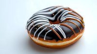 Chocolate glazed donut with white striped icing pattern on white background, fresh baked pastry with dark and light drizzle decoration for bakery and food design.