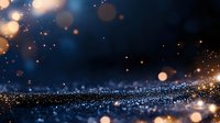 Magical glowing particles and bokeh lights on dark blue background with golden sparkles and shimmering dust creating dreamy atmosphere.