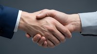 Two businessmen shaking hands in formal agreement, wearing navy and light blue suits. Isolated on gray background for corporate, partnership, and business concepts.