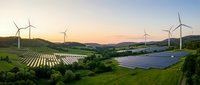 Renewable energy landscape with wind turbines and solar panels at sunset showcasing sustainable power generation in rolling green countryside.