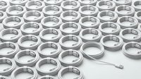 Silver wedding rings arranged in rows with one ring separated by arrow, symbolizing choice and commitment in marriage ceremony planning.