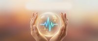 Hands holding glowing orb with heartbeat waveform symbol, representing healthcare, wellness, medical care, and life energy in warm sunset lighting.