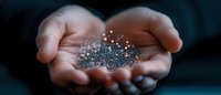 Magical glowing sparkles and stardust floating in cupped hands against dark background, creating mystical atmosphere for spiritual and wellness concepts.