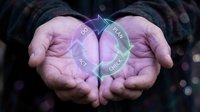 Close-up of open palms holding glowing holographic interface with digital data visualization, plan and budget icons, representing financial planning, technology solutions, and business strategy.