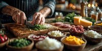 Chef preparing fresh ingredients on wooden cutting board with various colorful toppings in bowls for gourmet meal preparation in restaurant kitchen.