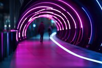 Futuristic tunnel with glowing pink and blue neon arches illuminating silhouette of person walking through modern architectural corridor at night.