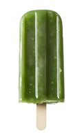 Green smoothie popsicle with wooden stick isolated on white background, frozen healthy dessert for summer refreshment and wellness concept.