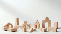 Natural wooden building blocks set arranged on white surface for educational play and creative construction activities.
