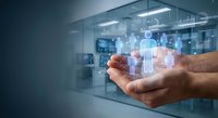 Digital healthcare technology concept with holographic medical icons floating above open hands in modern hospital environment for telemedicine applications.