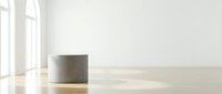 Empty modern interior space with concrete cylindrical column, wooden floor, and bright natural light from large windows, suitable for architectural visualization and commercial design projects.