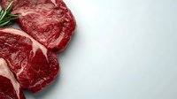 Fresh raw ribeye beef steaks with rosemary sprig on light gray background, close up view showing marbled texture and deep red color. For food photography and menus.