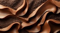 Smooth waves of milk chocolate ribbons flowing over dark cocoa powder background create luxurious culinary texture for dessert and confectionery designs.