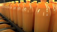 Orange juice bottles on industrial production line, arranged in rows showing automated beverage manufacturing process. Clean plastic containers filled with fresh juice.