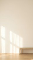 Minimalist interior with wooden bench against beige wall and natural sunlight casting geometric shadows on hardwood floor for modern home decor.