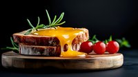 Grilled cheese sandwich with melted cheddar dripping down sides, fresh rosemary garnish and cherry tomatoes on wooden board against dark background.