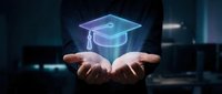 Businessman hands presenting holographic graduation cap symbol representing education technology, online learning, academic achievement and digital transformation.