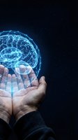 Glowing digital brain hologram floating above cupped hands against starry night sky background representing artificial intelligence and innovation.