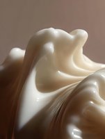 Smooth flowing curves of white cream or fabric create elegant abstract shapes against soft brown background, highlighting texture and gentle folds in minimalist style.
