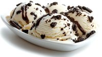 Vanilla ice cream scoops topped with chocolate cookie crumbles served in white bowl, frozen dessert for food and beverage advertising.