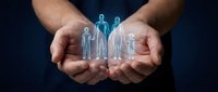 Protective hands holding glowing family figures representing life insurance, healthcare coverage, and family protection services for financial security.