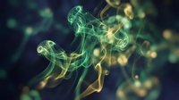 Abstract green and yellow smoke swirls creating fluid organic shapes against dark background for modern design projects and creative compositions.