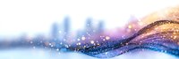 Magical flowing waves with sparkles and glitter effects in purple and gold colors against blurred winter background create dreamy abstract composition.