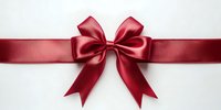 Red satin ribbon bow on white background, elegant gift wrapping decoration for holidays, celebrations, presents and festive occasions.