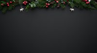 Festive evergreen garland with red ornaments and white reindeer decorations arranged on dark background, ideal for holiday greeting cards and seasonal marketing materials.