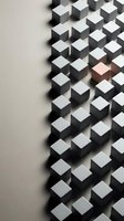Geometric white cubes arranged in rows with one distinctive copper cube standing out, representing uniqueness and leadership in business concepts.