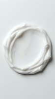 Creamy white skincare product smear with rich texture, isolated on neutral background for cosmetics, beauty, and wellness design applications.