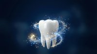 White tooth with magical sparkles and glowing particles on dark blue background for dental care and oral health concepts.