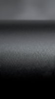 Abstract dark gray textured surface with soft focus background for modern design projects and product presentations.