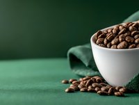 Chocolate cereal in white bowl on green surface with scattered pieces and cloth napkin, suitable for food packaging, breakfast advertising, and nutrition content.